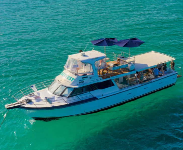 A Sea West charter vessel at anchor with guests aboard